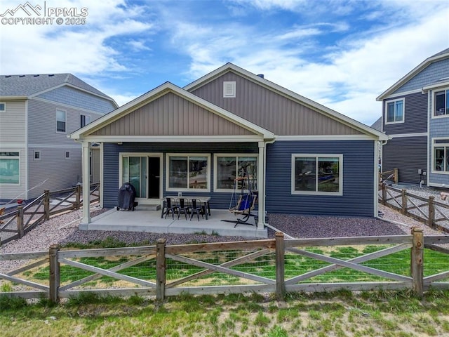 back of house with a patio and a fenced backyard