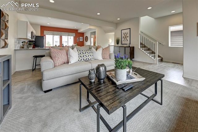 7367 Cornice Pt, Colorado Springs, CO 80923 - living area with light wood-style flooring, stairway, recessed lighting, and baseboards
