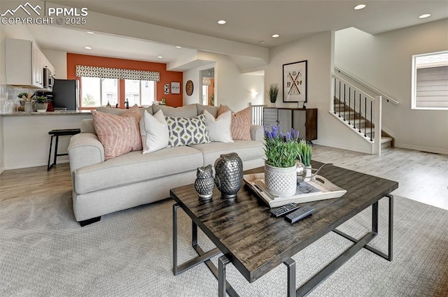 7367 Cornice Pt, Colorado Springs, CO 80923 - living room featuring light wood-type flooring, recessed lighting, and stairs