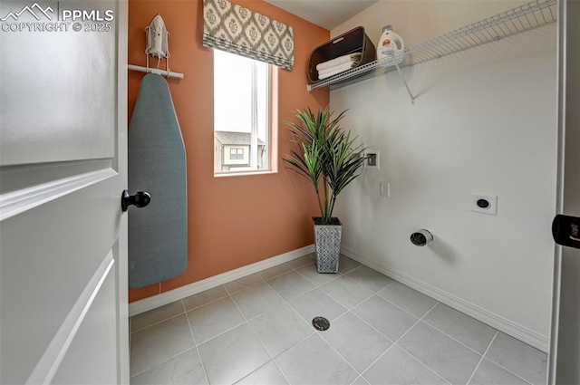 7367 Cornice Pt, Colorado Springs, CO 80923 - laundry area with electric dryer hookup, baseboards, washer hookup, and light tile patterned floors