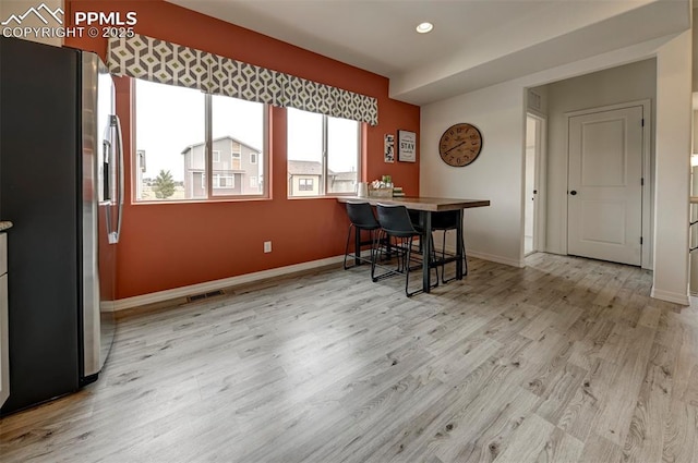 7367 Cornice Pt, Colorado Springs, CO 80923 - dining space with light wood-type flooring, baseboards, and recessed lighting