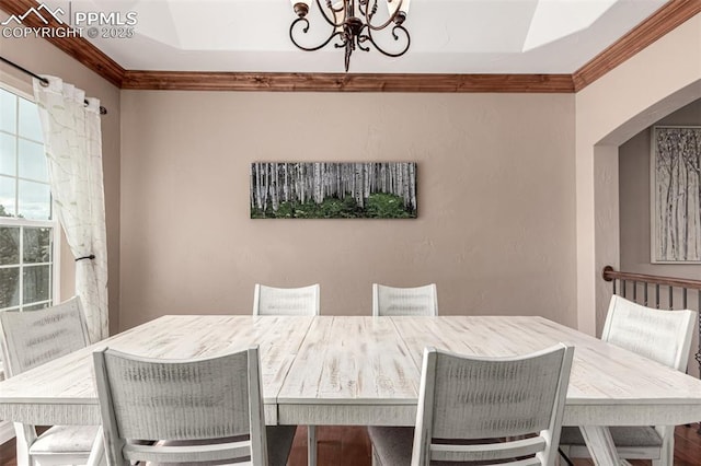 20097 Royal Troon Dr, Monument, CO 80132 - dining space featuring a chandelier, crown molding, and arched walkways