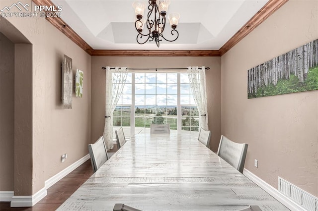 20097 Royal Troon Dr, Monument, CO 80132 - dining space featuring a tray ceiling, a chandelier, dark wood-style flooring, a textured wall, and baseboards