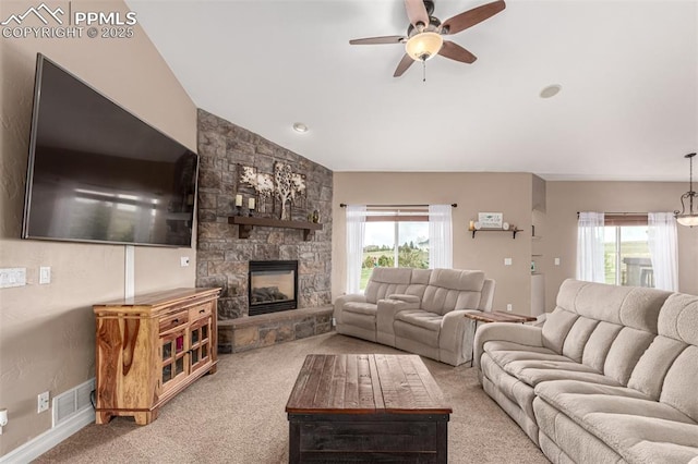 20097 Royal Troon Dr, Monument, CO 80132 - living room featuring carpet, ceiling fan, a stone fireplace, and lofted ceiling