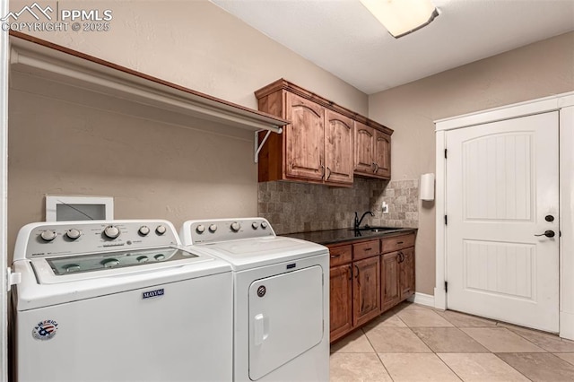 20097 Royal Troon Dr, Monument, CO 80132 - laundry room featuring independent washer and dryer, light tile patterned floors, and cabinet space