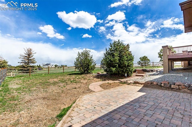 20097 Royal Troon Dr, Monument, CO 80132 - view of yard featuring a patio area, fence, a rural view, and a wooden deck