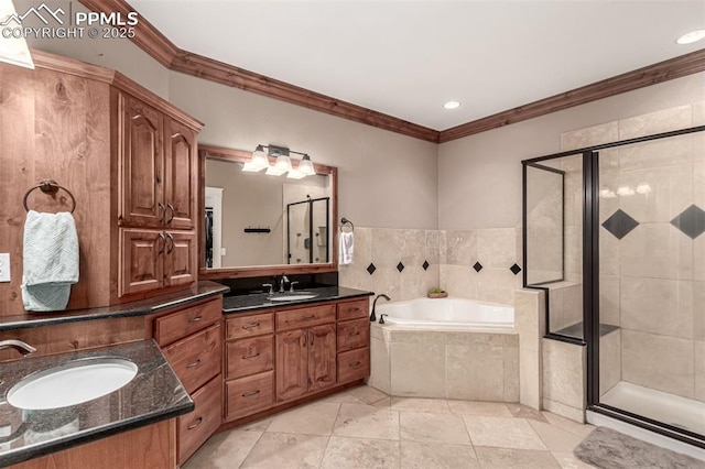 20097 Royal Troon Dr, Monument, CO 80132 - bathroom with crown molding, a shower stall, a bath, two vanities, and recessed lighting