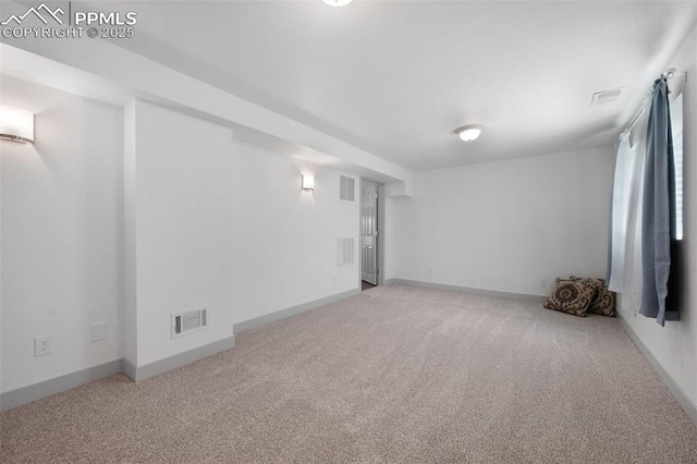 basement featuring carpet floors and baseboards