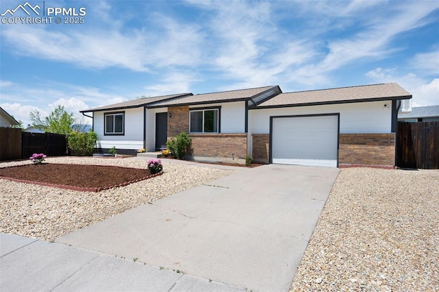 ranch-style home with brick siding, driveway, a garage, and fence