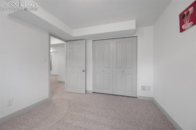 unfurnished bedroom with carpet and baseboards