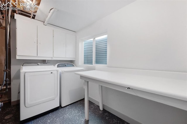 laundry room featuring cabinet space, washing machine and dryer, and baseboards