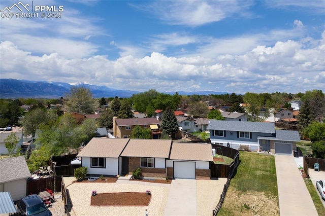 aerial view of residential area with a mountainous background