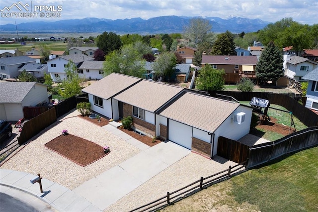 aerial perspective of suburban area with mountains
