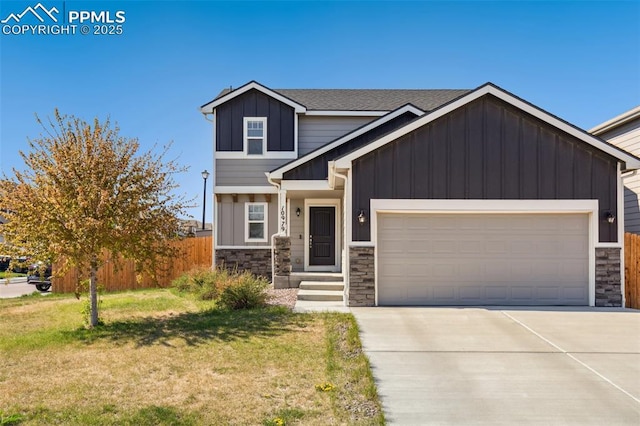 craftsman-style house featuring stone siding, board and batten siding, an attached garage, driveway, and a shingled roof