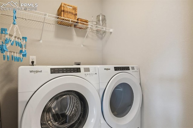 clothes washing area featuring washer and dryer