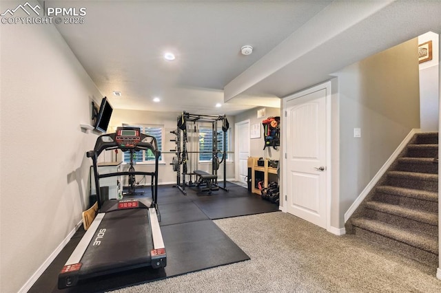 exercise room featuring baseboards and recessed lighting