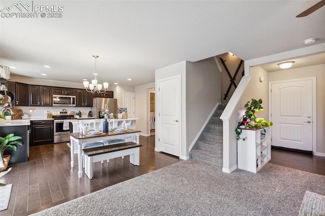 dining room featuring stairs, baseboards, a chandelier, recessed lighting, and dark wood-style floors
