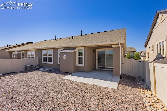 4479 Hessite Loop, Colorado Springs, CO 80938 - rear view of house featuring a fenced backyard, a patio, stucco siding, and roof with shingles