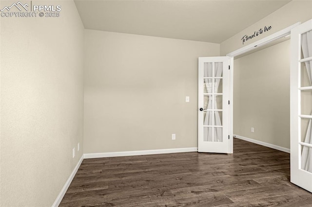 4479 Hessite Loop, Colorado Springs, CO 80938 - empty room with french doors, dark wood-style flooring, and baseboards