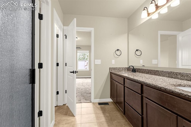 4479 Hessite Loop, Colorado Springs, CO 80938 - full bath featuring tile patterned floors, double vanity, and baseboards