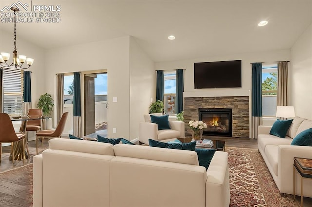 4479 Hessite Loop, Colorado Springs, CO 80938 - living area featuring a chandelier, a fireplace, recessed lighting, wood finished floors, and baseboards