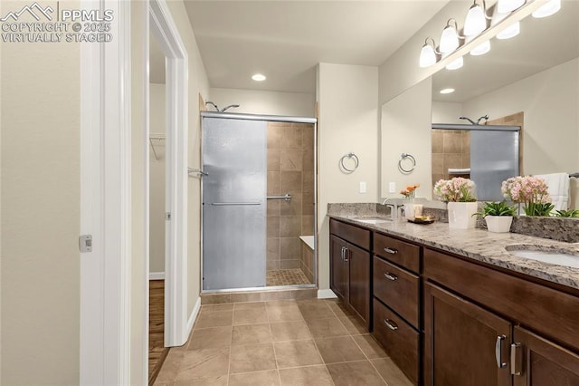 4473 Hessite Loop, Colorado Springs, CO 80938 - full bathroom featuring a shower stall, tile patterned floors, a walk in closet, double vanity, and recessed lighting