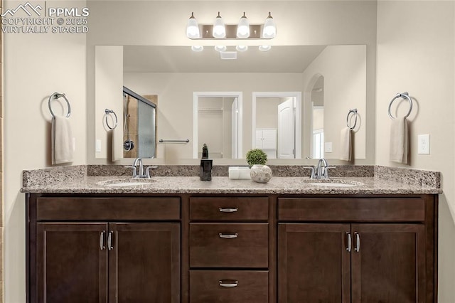 4473 Hessite Loop, Colorado Springs, CO 80938 - full bathroom with a shower stall and double vanity