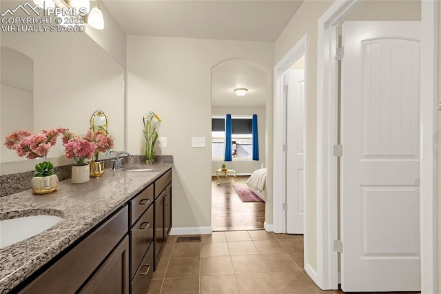 4473 Hessite Loop, Colorado Springs, CO 80938 - bathroom featuring ensuite bath, tile patterned floors, double vanity, and baseboards