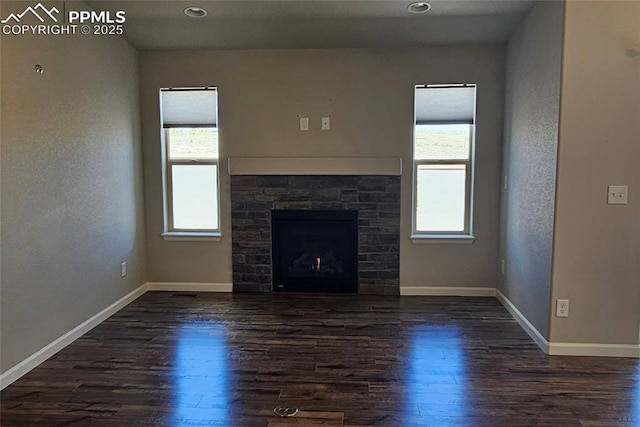 4473 Hessite Loop, Colorado Springs, CO 80938 - unfurnished living room with plenty of natural light, dark wood-style flooring, baseboards, and recessed lighting