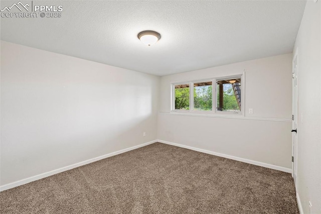 1308 Mesa Ave, Colorado Springs, CO 80906 - carpeted empty room featuring baseboards and a textured ceiling