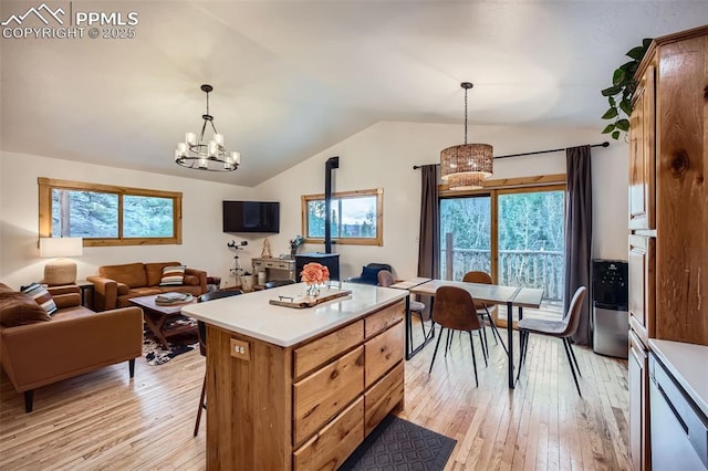 1978 High Chateau Rd, Florissant, CO 80816 - kitchen featuring a chandelier, vaulted ceiling, open floor plan, and healthy amount of natural light