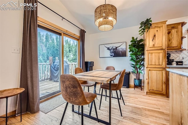 1978 High Chateau Rd, Florissant, CO 80816 - dining space featuring light wood-style flooring, lofted ceiling, and a chandelier