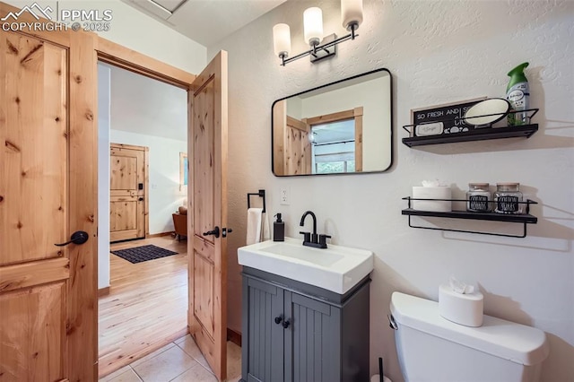 1978 High Chateau Rd, Florissant, CO 80816 - half bathroom with toilet, vanity, and tile patterned flooring