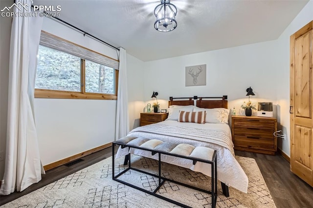 1978 High Chateau Rd, Florissant, CO 80816 - bedroom featuring dark wood-style flooring and baseboards