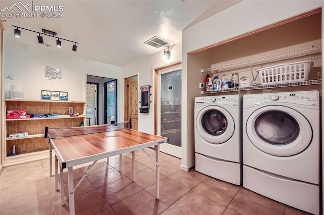 1978 High Chateau Rd, Florissant, CO 80816 - laundry room with rail lighting, separate washer and dryer, and light tile patterned floors