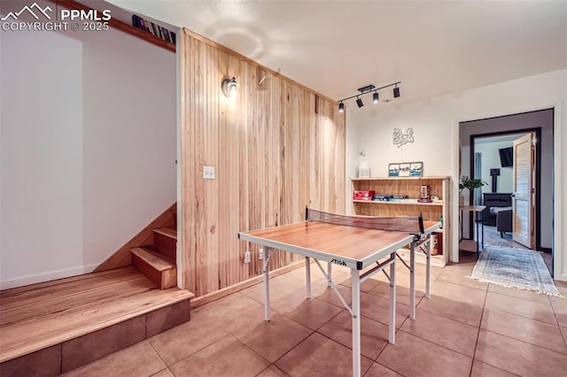 1978 High Chateau Rd, Florissant, CO 80816 - rec room featuring tile patterned flooring, wooden walls, and rail lighting