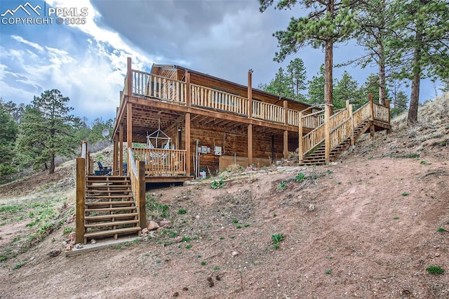 1978 High Chateau Rd, Florissant, CO 80816 - back of property featuring stairway and a deck