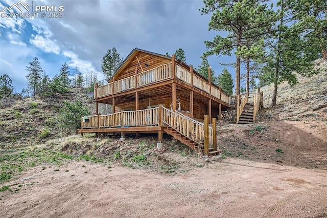 1978 High Chateau Rd, Florissant, CO 80816 - view of front facade featuring stairs and a wooden deck
