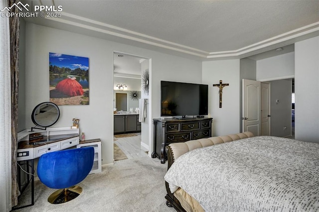 bedroom featuring light carpet, ensuite bathroom, and baseboards