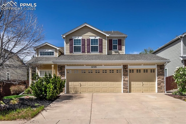 6726 Annanhill Pl, Colorado Springs, CO 80922 - traditional home featuring concrete driveway, an attached garage, stone siding, and a shingled roof