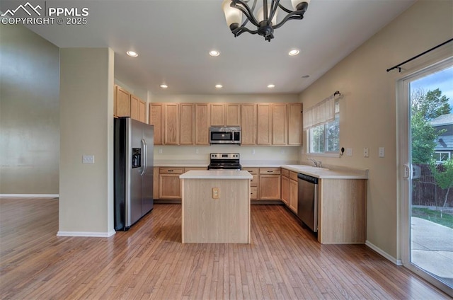 6726 Annanhill Pl, Colorado Springs, CO 80922 - kitchen featuring stainless steel appliances, light brown cabinetry, light wood finished floors, and recessed lighting