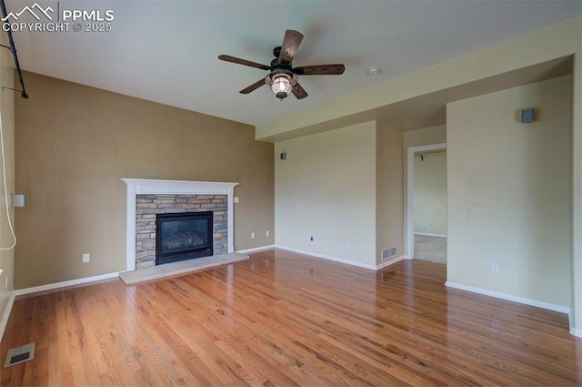 6726 Annanhill Pl, Colorado Springs, CO 80922 - unfurnished living room with ceiling fan, wood finished floors, and baseboards