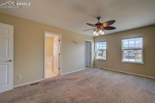 6726 Annanhill Pl, Colorado Springs, CO 80922 - unfurnished bedroom featuring light carpet, baseboards, ensuite bath, and ceiling fan