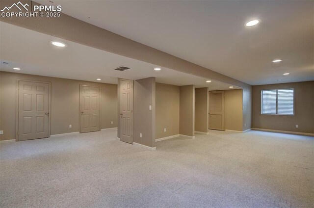 6726 Annanhill Pl, Colorado Springs, CO 80922 - below grade area with recessed lighting, light carpet, and baseboards