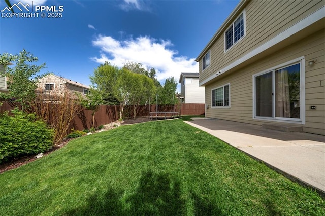 6726 Annanhill Pl, Colorado Springs, CO 80922 - view of yard featuring a trampoline and a patio area