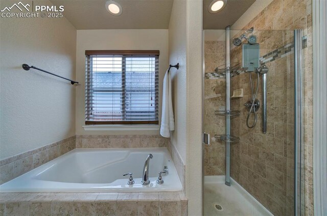 6752 Red Cardinal Loop, Colorado Springs, CO 80908 - bathroom with a stall shower and a garden tub