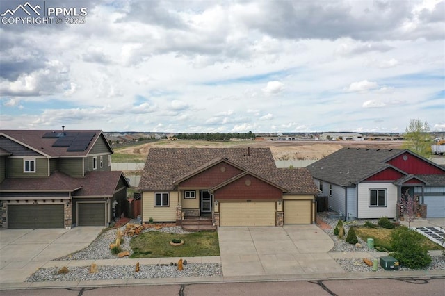 6752 Red Cardinal Loop, Colorado Springs, CO 80908 - craftsman-style house with driveway, an attached garage, and stone siding