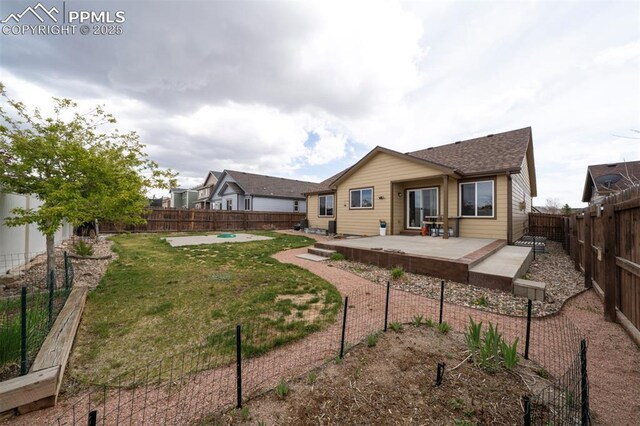 6752 Red Cardinal Loop, Colorado Springs, CO 80908 - rear view of house with a patio