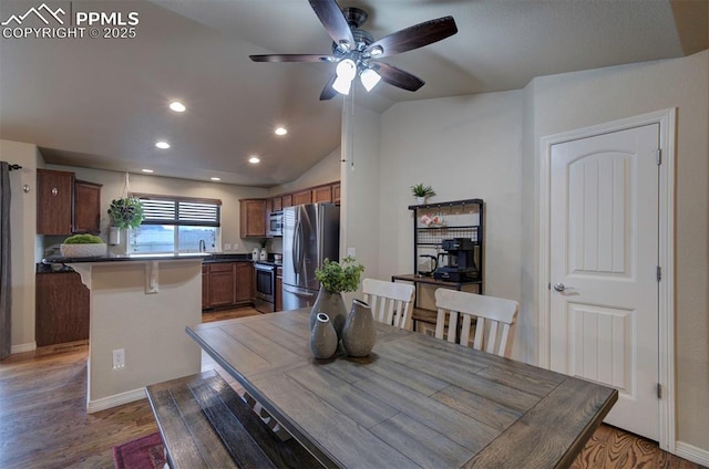 6752 Red Cardinal Loop, Colorado Springs, CO 80908 - dining space featuring a ceiling fan, light wood-style floors, lofted ceiling, and recessed lighting