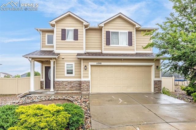 11081 Buckhead Pl, Fountain, CO 80817 - view of front facade featuring stone siding, an attached garage, concrete driveway, and a shingled roof